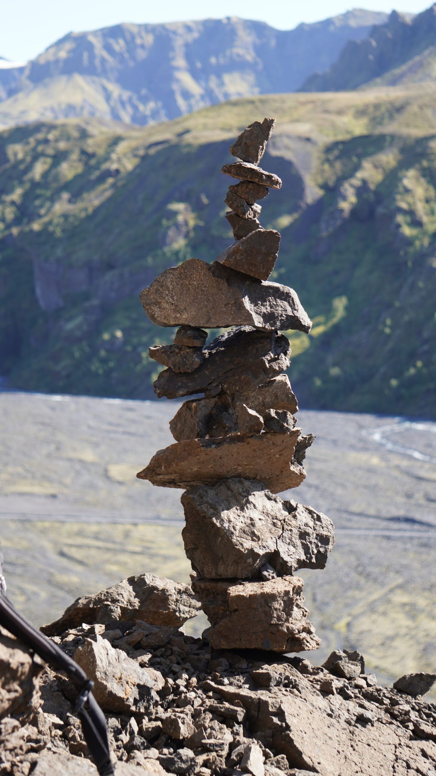 A balanced cairn against a natural backdrop