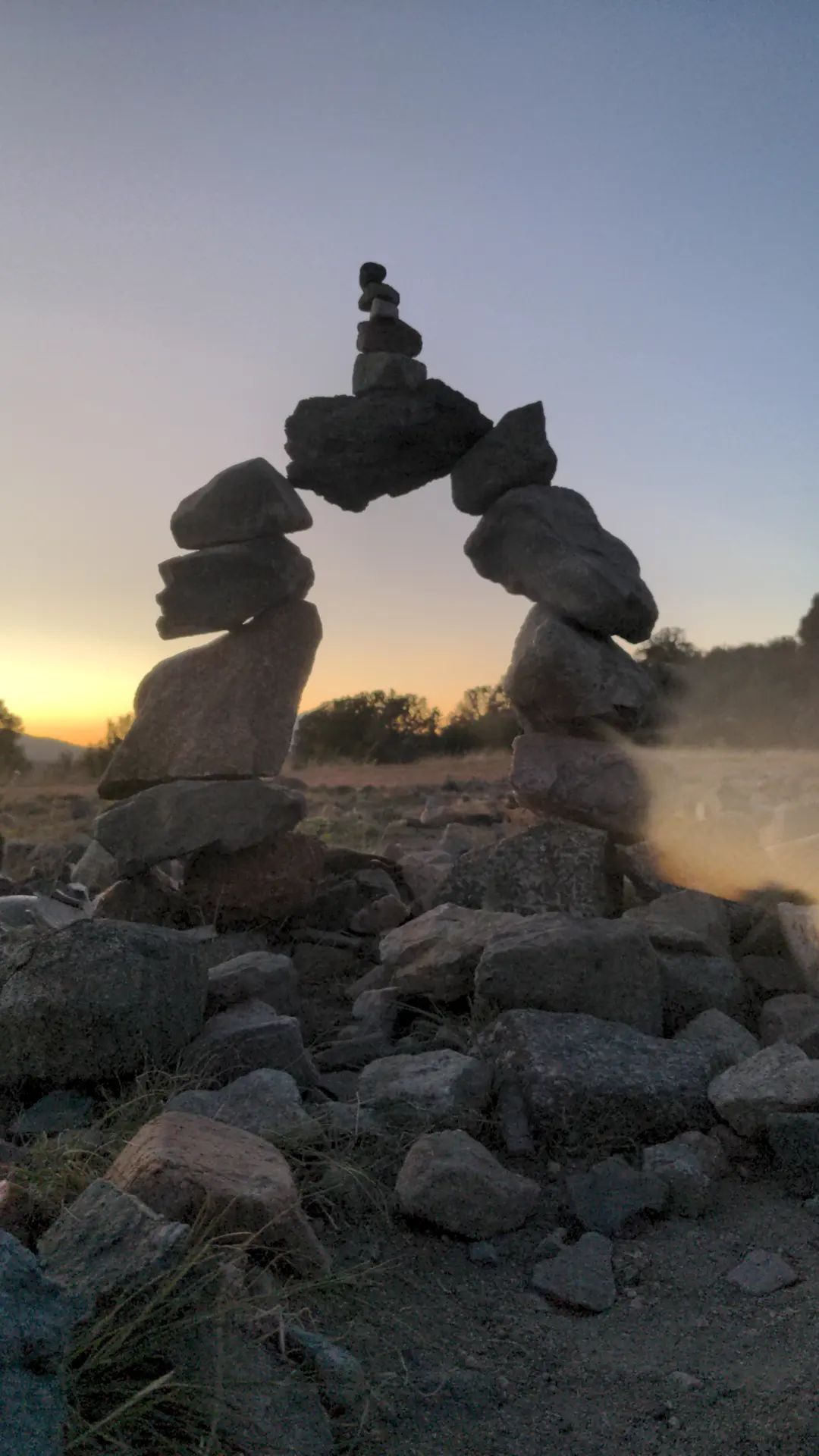 A stacked stone cairn in natural light